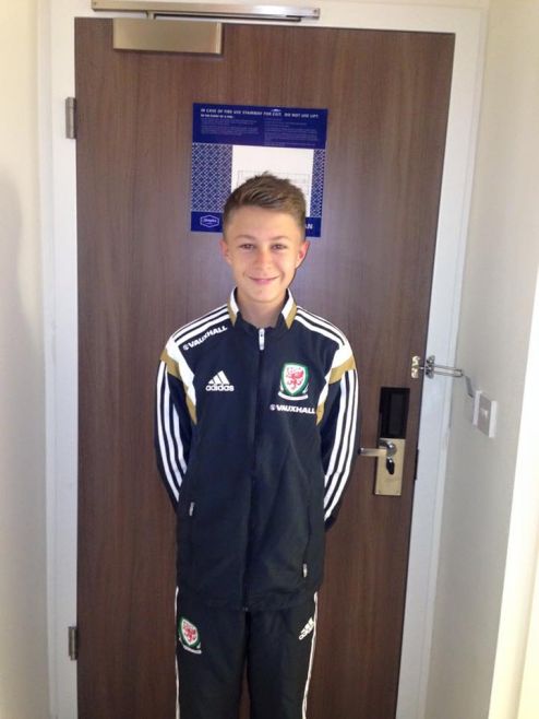Dom in his Wales football tracksuit